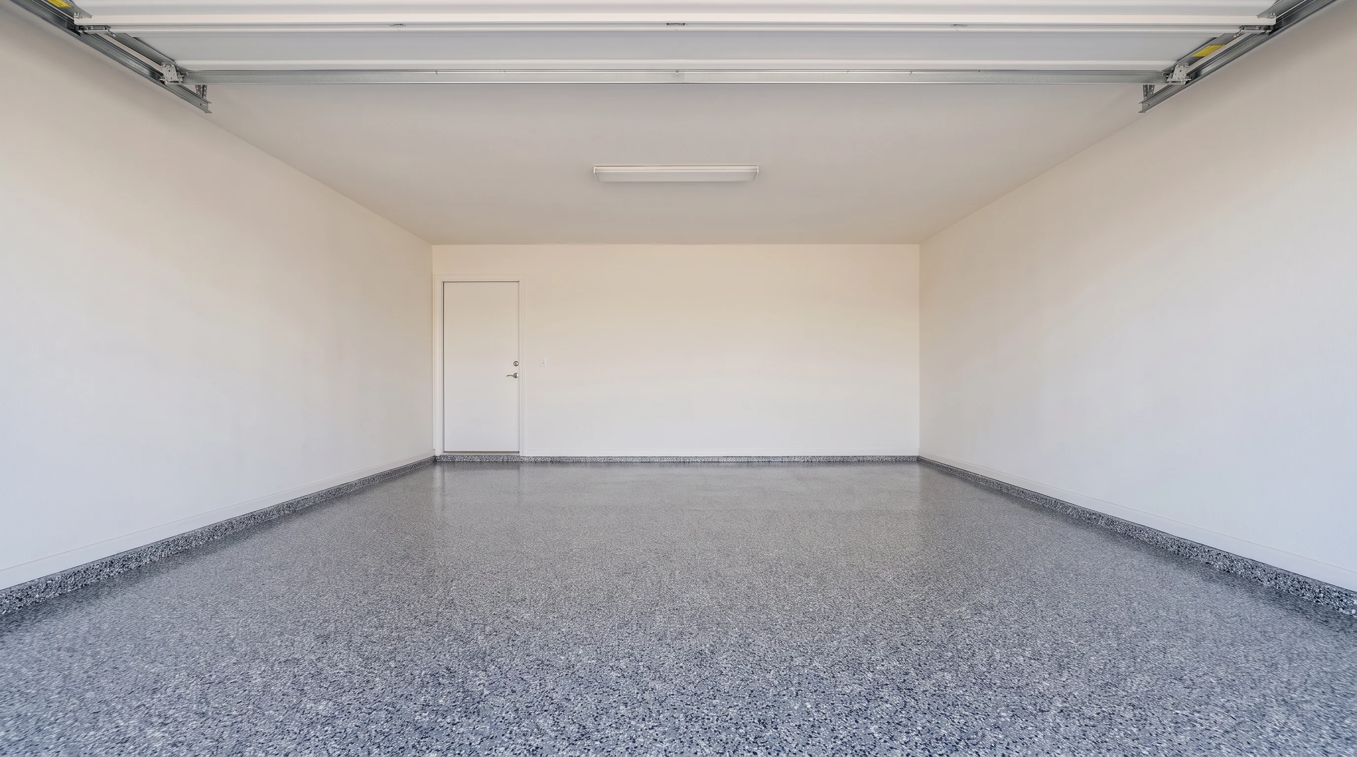 Finished charcoal decorative flake epoxy garage floor in Chilliwack, BC